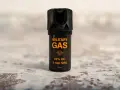 Czarny gaz pieprzowy z pomarańczowym napisem "MILITARY GAS" i informacją "Stream".