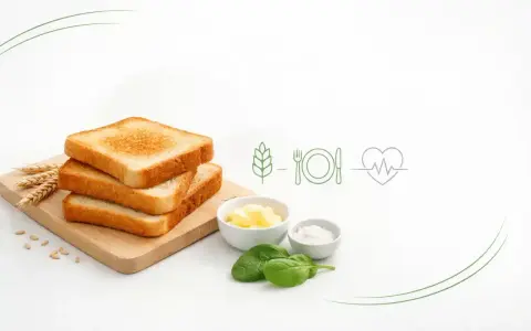 Stos tostowy, masło, sól, szpinak i symbole zdrowia. Czy chleb tostowy jest zdrowy? Zależy od dodatków i sposobu przygotowania.
